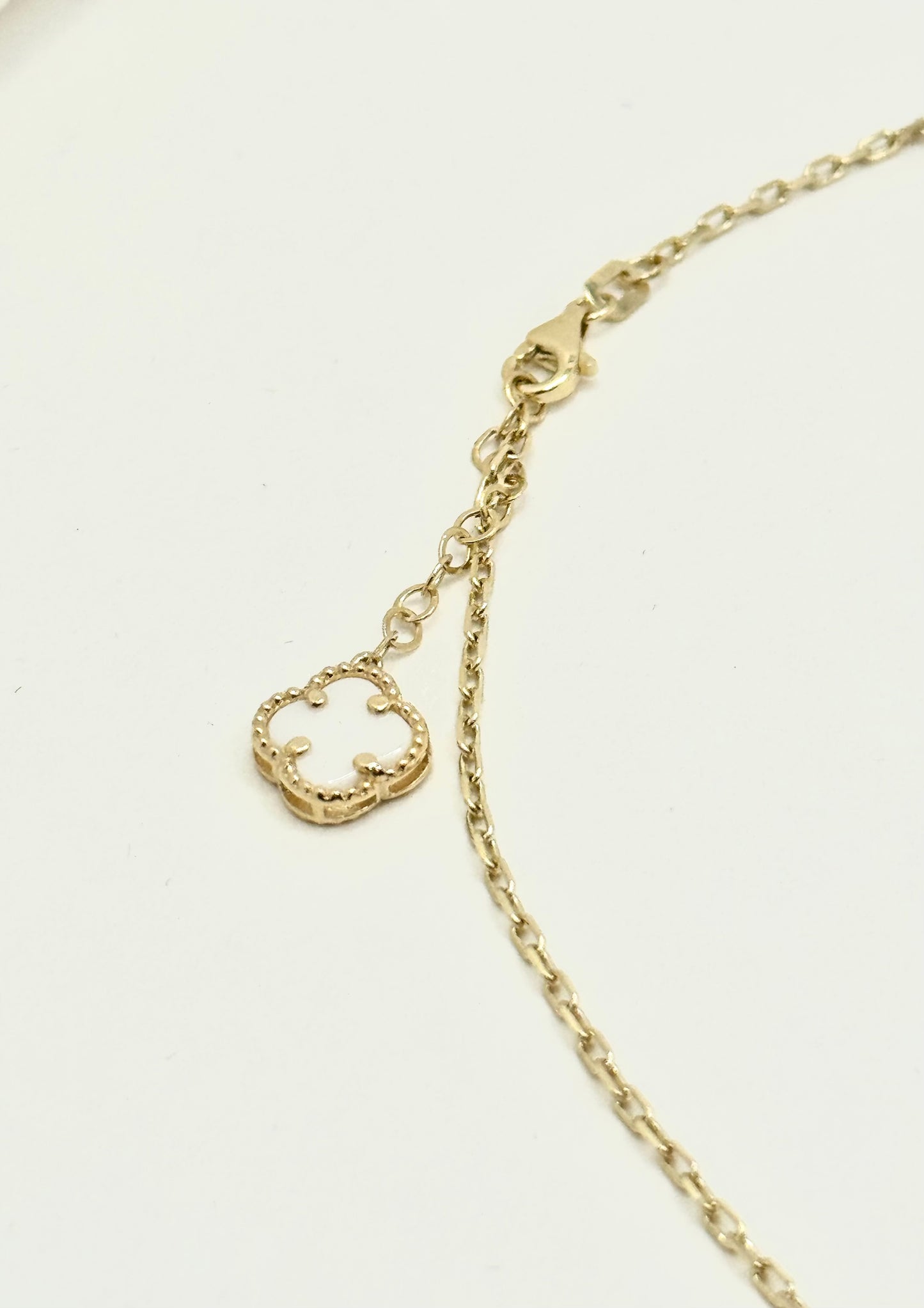 16-inch 14K gold clover chain and a matching 8-inch bracelet
