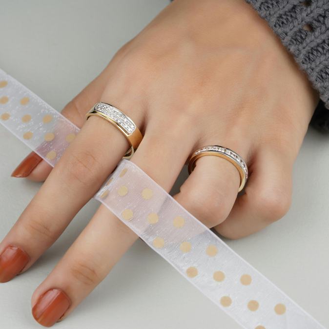 Women wearing a pair 14k gold ring 