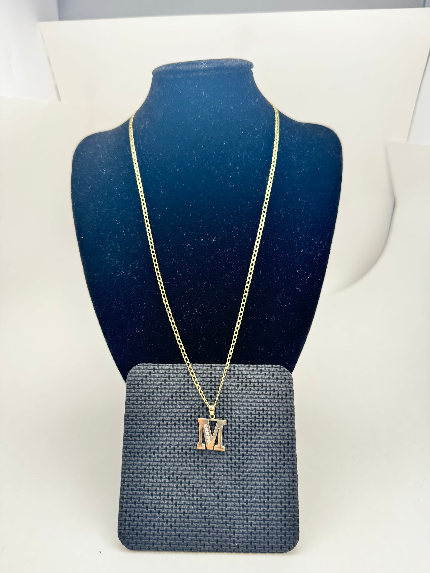 14 karat gold Cuban link chain with M pendant, yellow gold