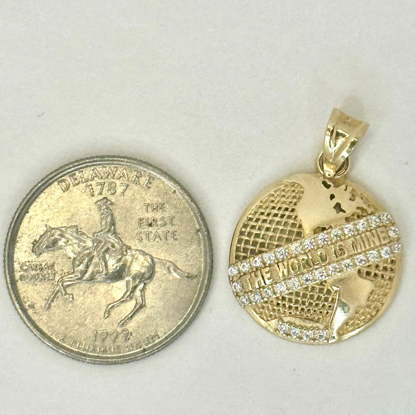 14k Gold inspired world pendant with cubic zirconia