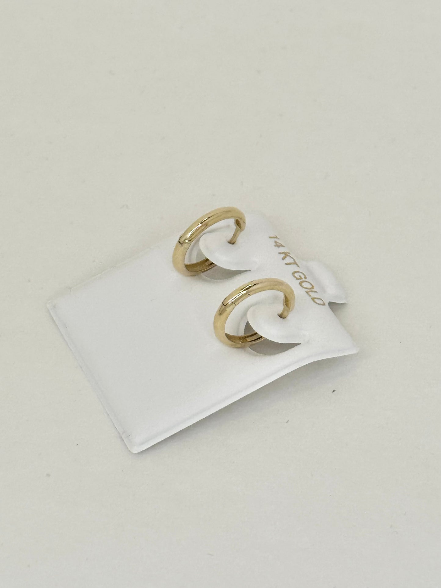 14k gold Huggie round earring